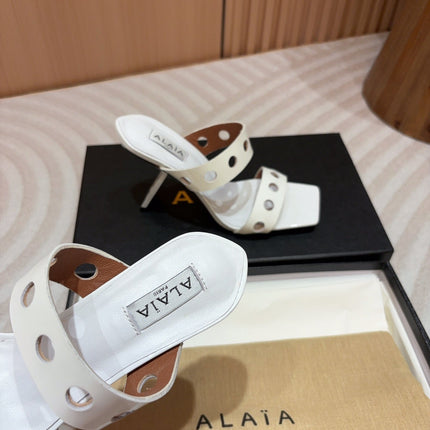 ALAIA TWO-STRAPS HIGH HEEL SANDALS IN WHITE PATENT LAMBSKIN