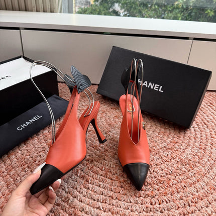 CHANEL 26S POINTED TOE HIGH HEEL SLINGBACKS IN ORANGE LAMBSKIN WITH BLACK FLORAL APPLIQUE