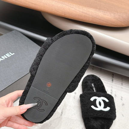 CHANEL 26S SLIDE MULES IN BLACK SHEARLING AND WHITE CC LOGO