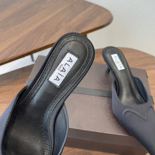 ALAIA 26S HEELED MULES 50 MM IN BLACK FABRIC