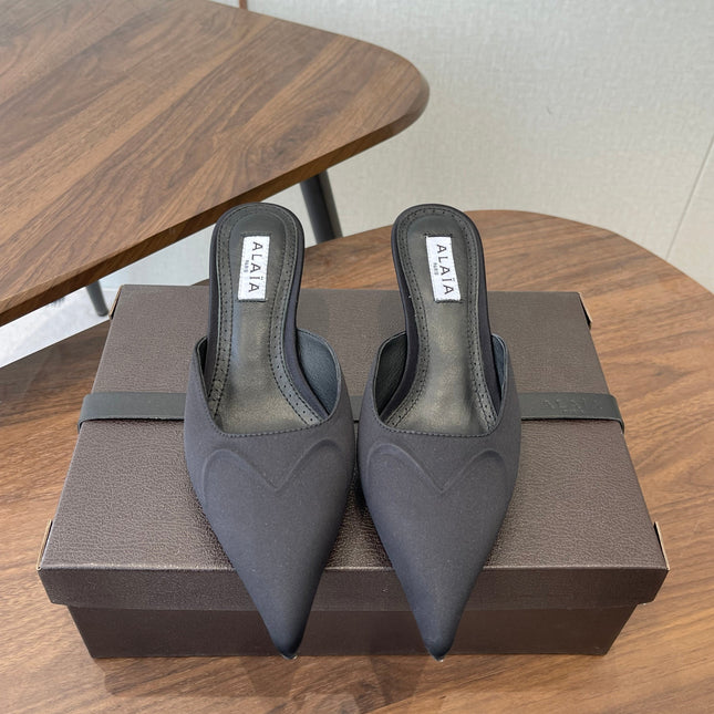 ALAIA 26S HEELED MULES 50 MM IN BLACK FABRIC
