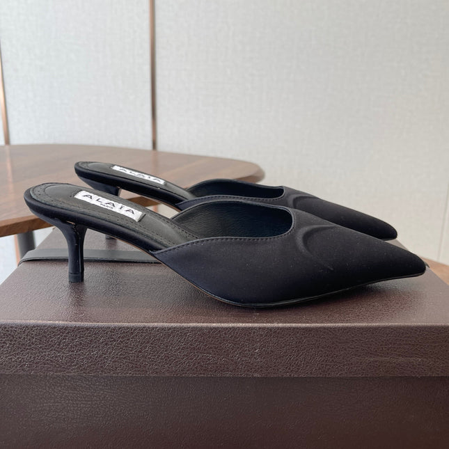 ALAIA 26S HEELED MULES 50 MM IN BLACK FABRIC