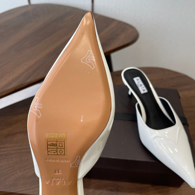 ALAIA 26S HEELED MULES 50 MM IN WHITE GLOSSY CALFSKIN