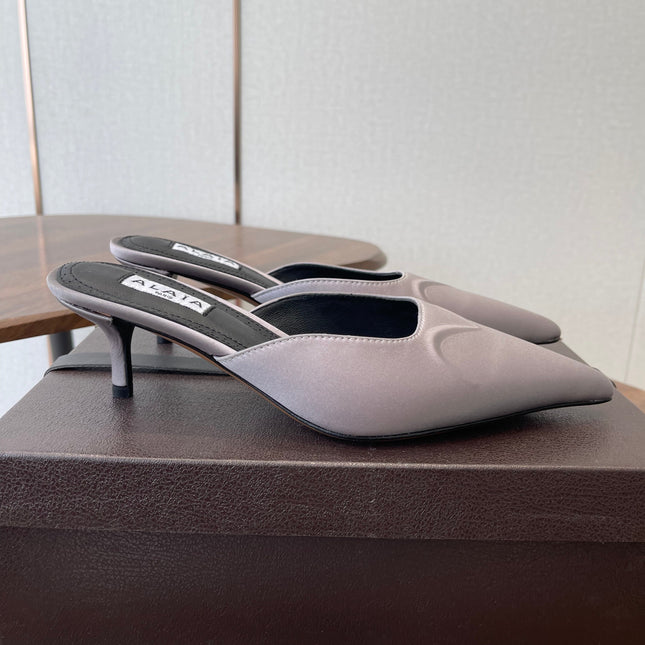 ALAIA 26S HEELED MULES 50 MM IN LAVENDER GREY FABRIC