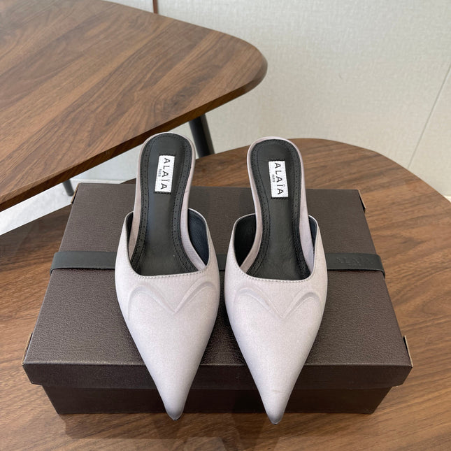 ALAIA 26S HEELED MULES 50 MM IN LAVENDER GREY FABRIC