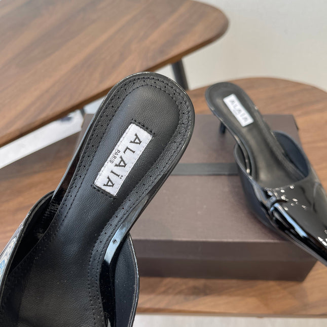 ALAIA 26S HEELED MULES 50 MM IN BLACK GLOSSY CALFSKIN