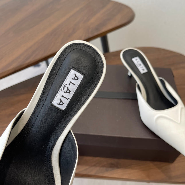 ALAIA 26S HEELED MULES 50 MM IN WHITE FABRIC