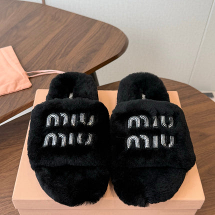 MIUMIU 26S CRYSTAL LOGO SLIDES IN BLACK SHEARLING