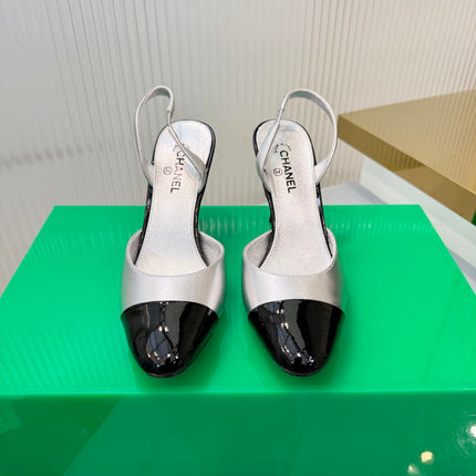 CHANEL 26S SLINGBACK POINTED-TOE HEELS 95 MM IN SILVER LAMBSKIN WITH BLACK CAP TOE