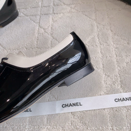 CHANEL 25S TWO TONE LACE UP IN BLACK AND WHITE SHINY CALFSKIN