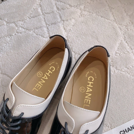 CHANEL 25S TWO TONE LACE UP IN BLACK AND WHITE SHINY CALFSKIN