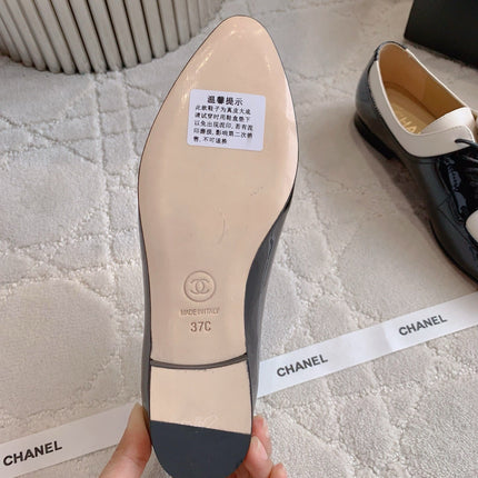 CHANEL 25S TWO TONE LACE UP IN BLACK AND WHITE SHINY CALFSKIN