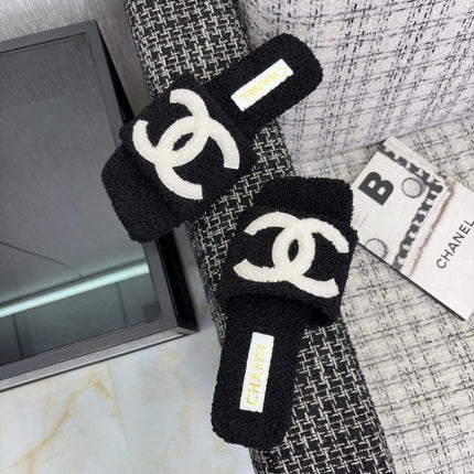CHANEL 26S SLIDE SANDALS IN BLACK SHEARLING AND WHITE CC LOGO SQUARE TOE