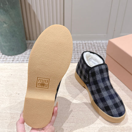 MIUMIU 25S SLIP-ON BOOTIES IN BLACK AND BLUE WOOL WITH SHEARLING