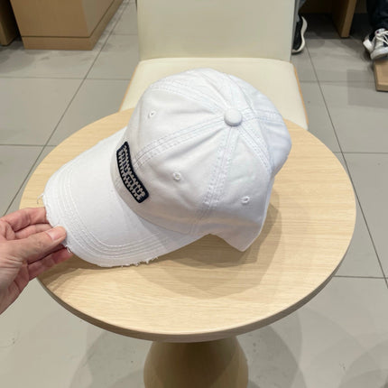 MIUMIU DISTRESSED FABRIC BASEBALL CAP IN WHITE WITH EMBROIDERED LOGO