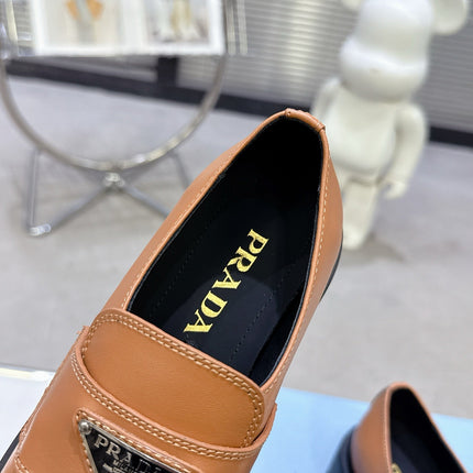 PRADA 25S THICK-SOLE LOAFERS 60 MM IN COGNAC BROWN CALFSKIN