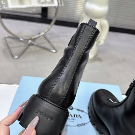 PRADA 25S ZIP-UP ANKLE BOOTS IN BLACK CALFSKIN