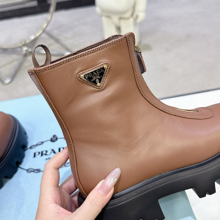 PRADA 25S ZIP-UP ANKLE BOOTS IN BROWN CALFSKIN