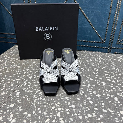 BALMAIN 26S HIGH-HEEL SANDALS 95 MM IN BLACK CALFSKIN AND WHITE FABRIC