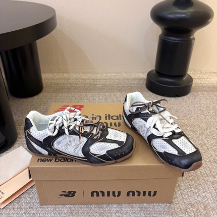 MIUMIU 26S PERFORATED SNEAKERS IN WHITE AND BLACK CALFSKIN