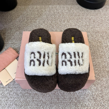 MIUMIU 26S PLATFORM SLIDES IN DARK BROWN AND WHITE SHEARLING