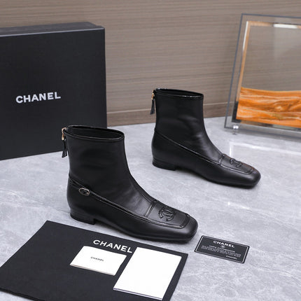 CHANEL 26S ANKLE BOOTS IN BLACK CALFSKIN WITH PATENT LEATHER TRIM AND CC LOGO ON TOE CAP