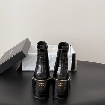 CHANEL 26S CHELSEA ANKLE BOOTS 70 MM IN BLACK EMBOSSED AND PATENT