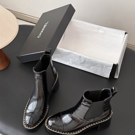CHANEL 26S CHELSEA ANKLE BOOTS 70 MM IN BLACK EMBOSSED AND PATENT