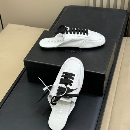 PRADA 25S COLLAPSE MULES IN WHITE CALFSKIN