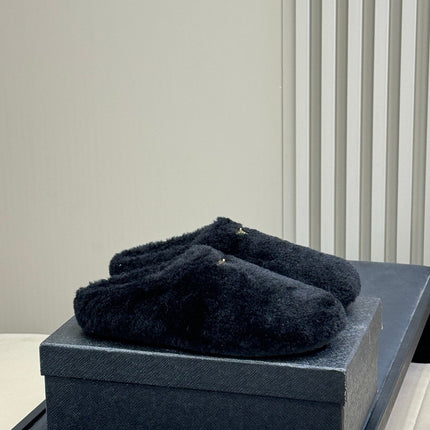 PRADA 25S CLOGS IN BLACK SHEARLING