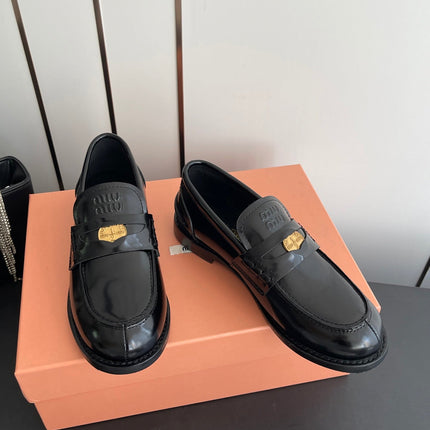 MIUMIU 26S PENNY LOAFERS IN BLACK GLOSSY CALFSKIN GOLD HARDWARE