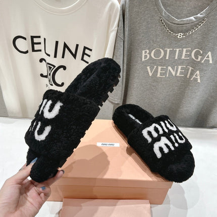 MIUMIU 26S SANDALS IN BLACK SHEARLING WITH LOGO LETTERING